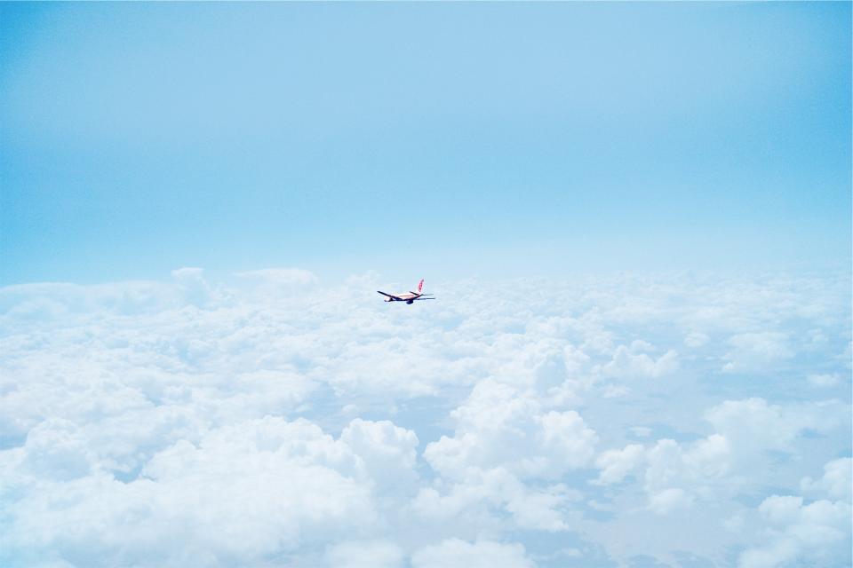 Airplane Above The Clouds