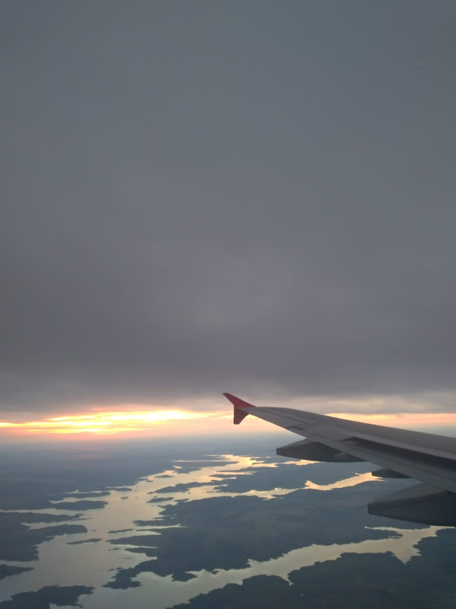 An airplane wing above water
