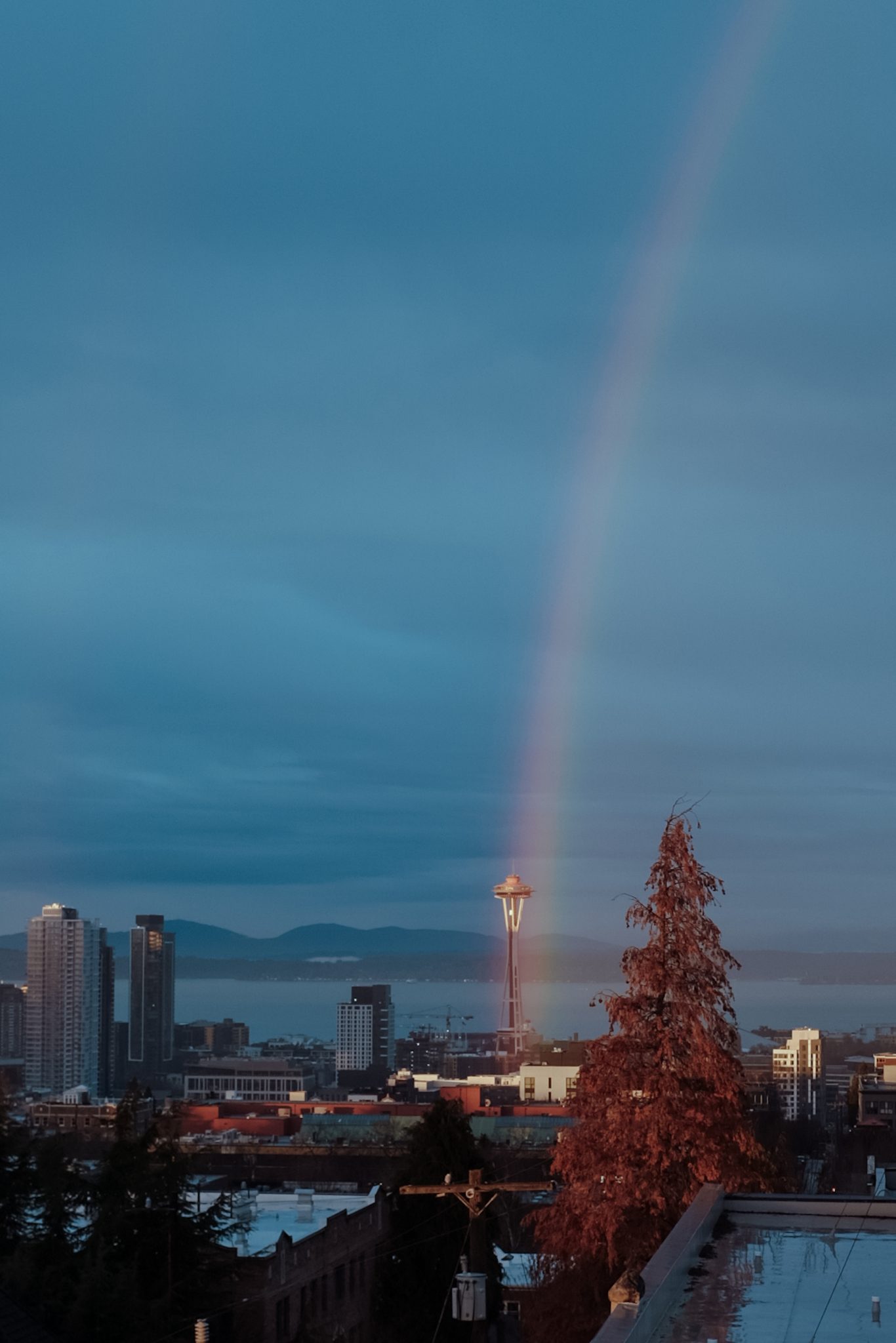 Moody rainbow next to Seattle's space needle