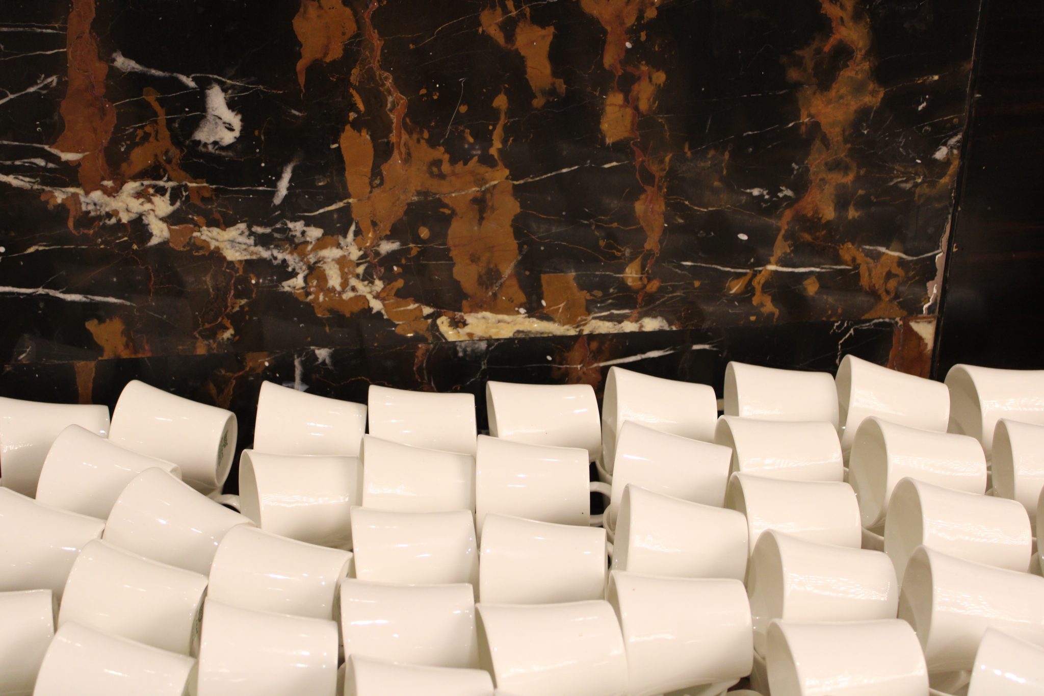 Wall with white tea cups