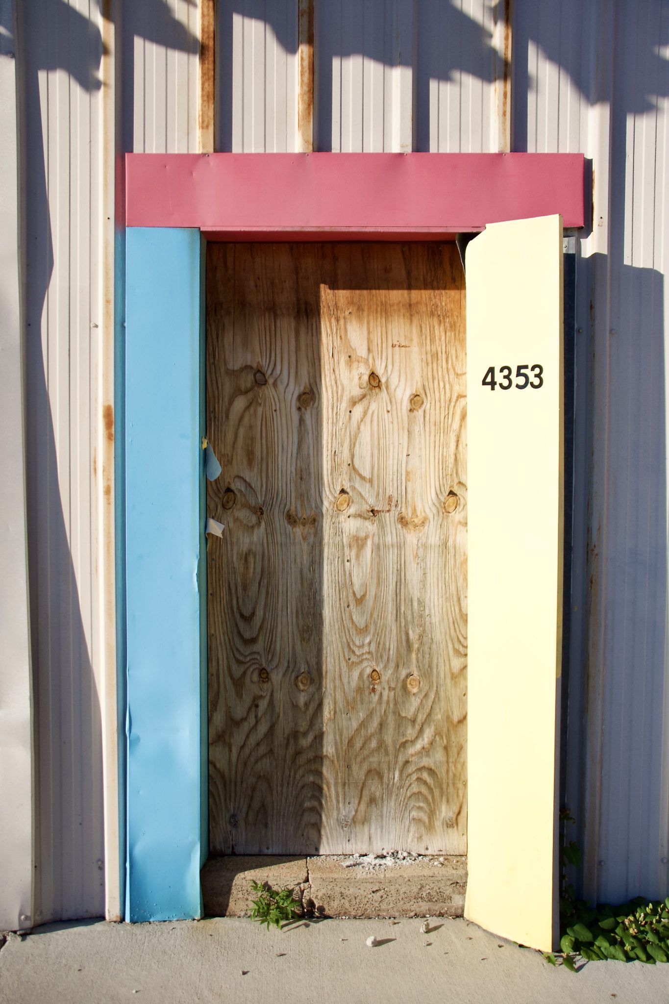 Colorful boarded up doorway in St. Louis' Central West End