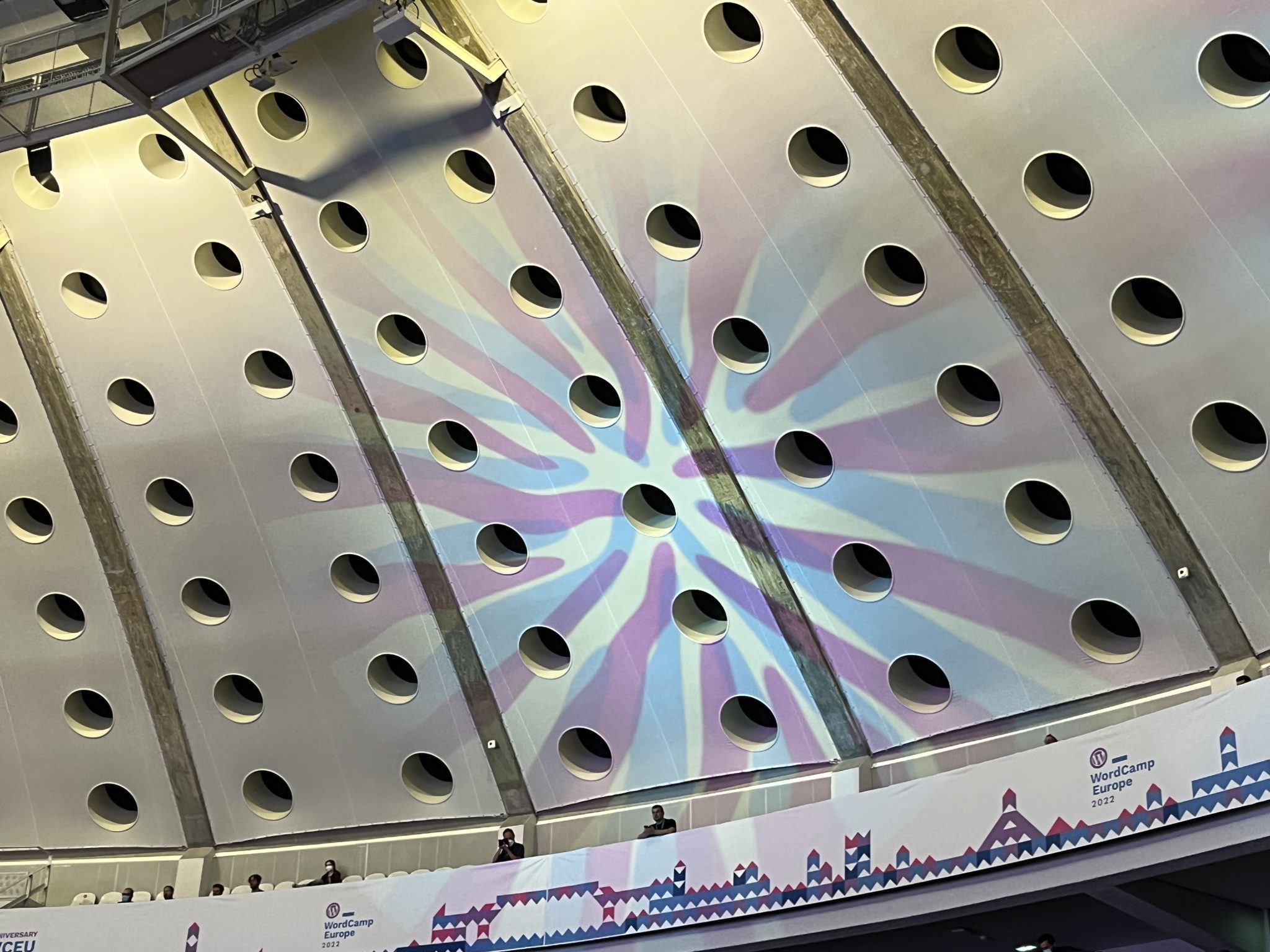 Light splashes on a conference hall ceiling