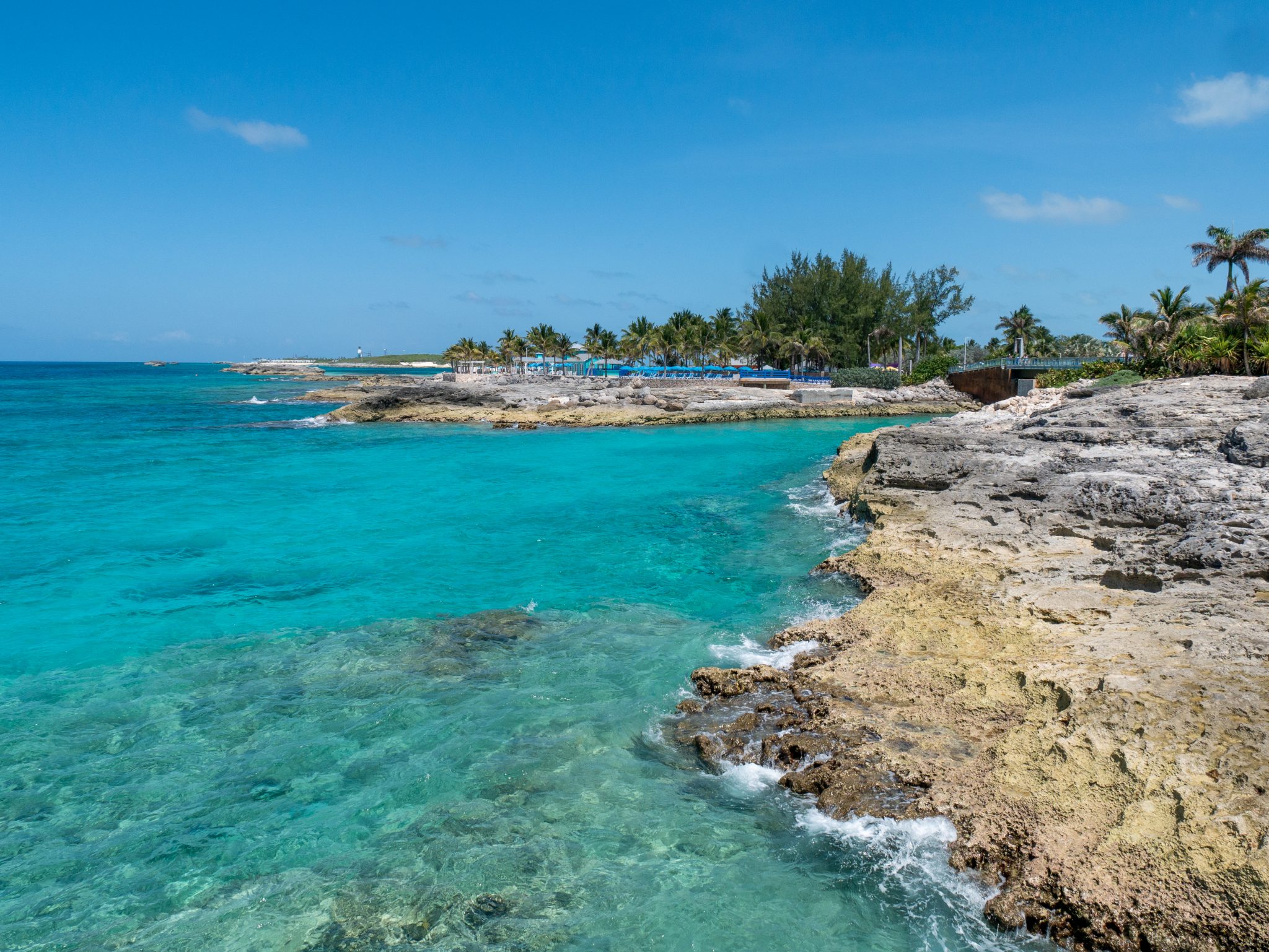 Rocky shore along clear blue tropical waters