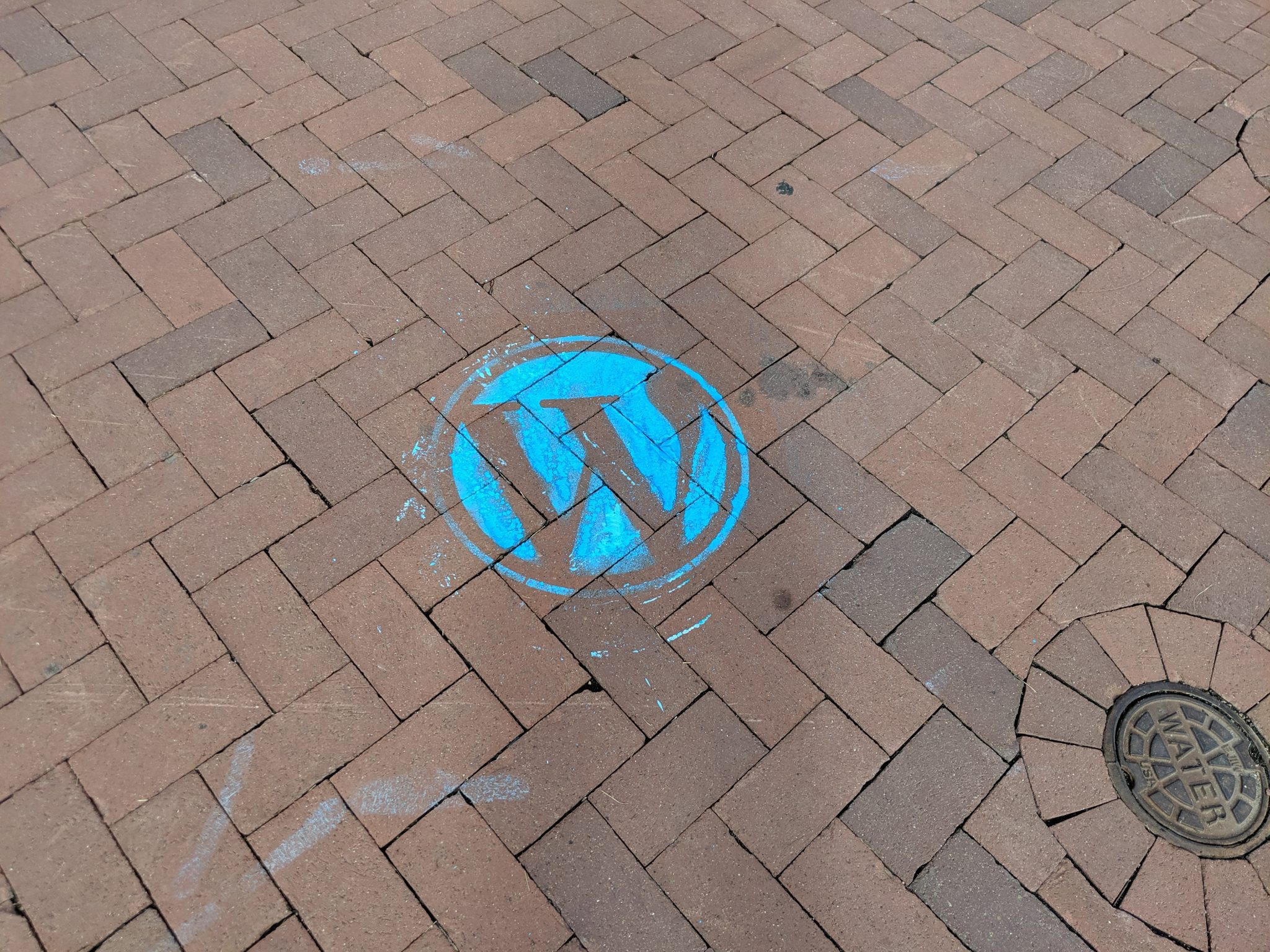 WordPress logo chalked on the ground