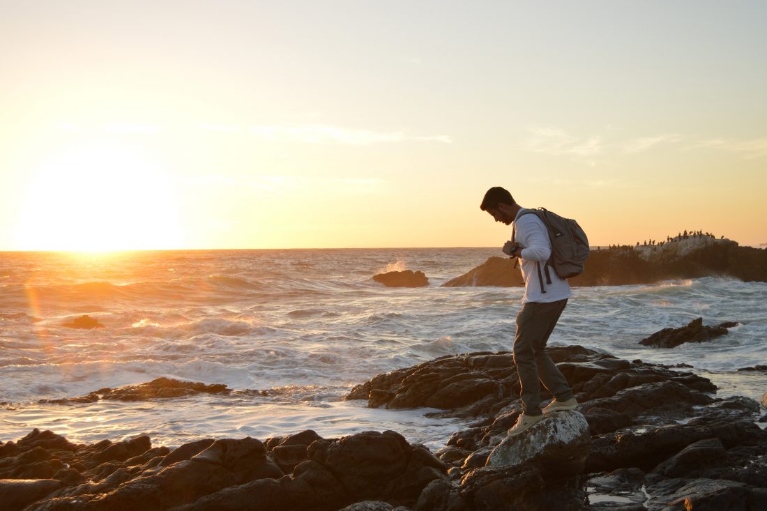 Man on Rocky Coast