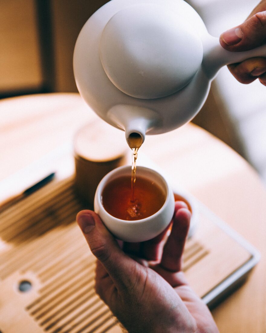 Hands Pouring Tea