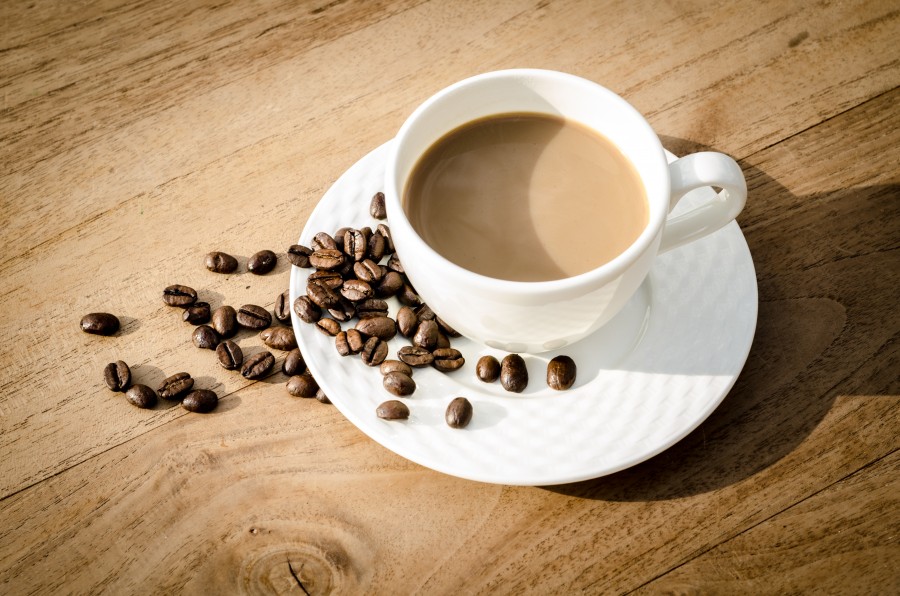 Cup of coffee with beans