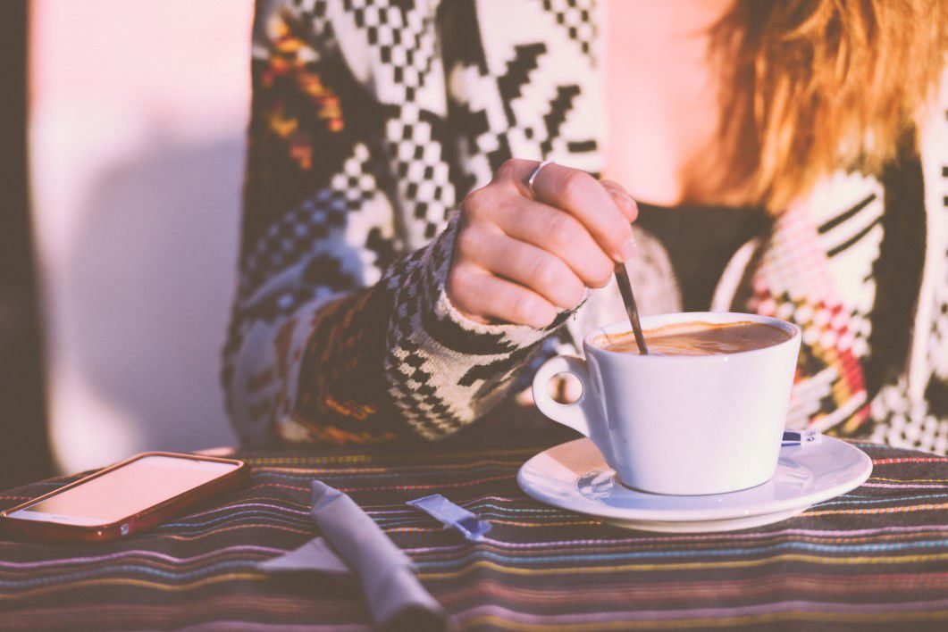 Woman Stirring Coffee