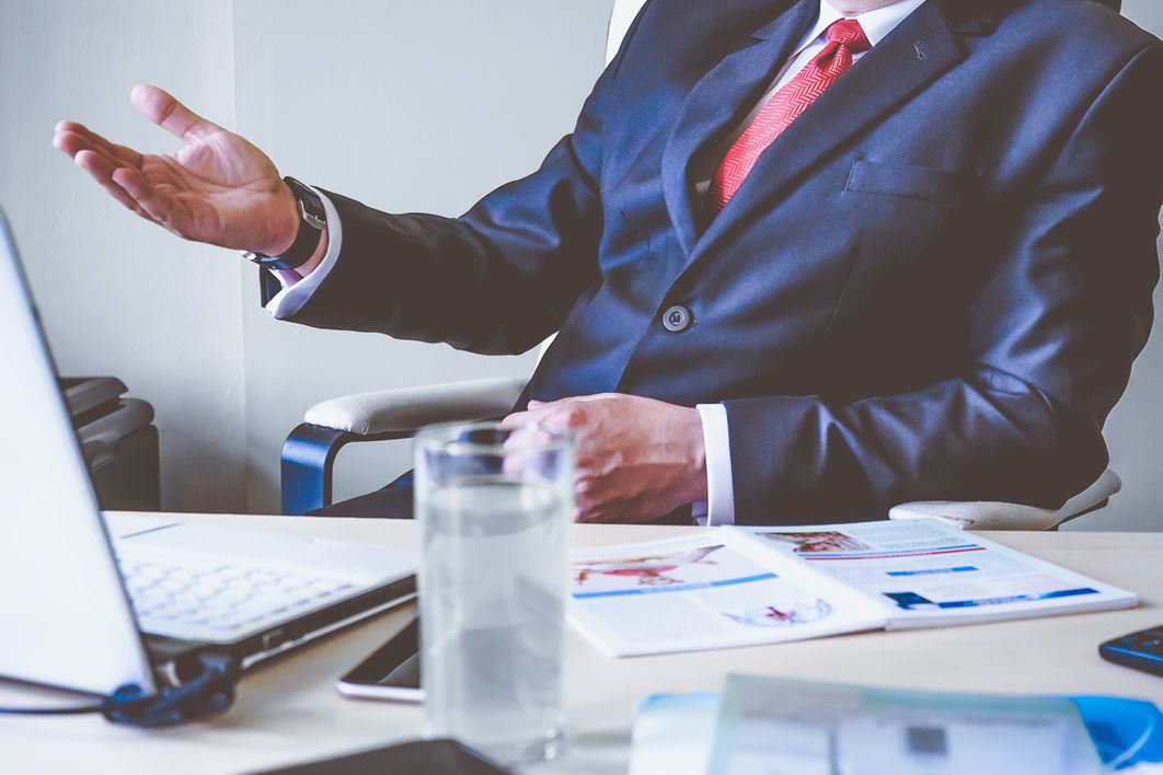 Man Business Talking Desk