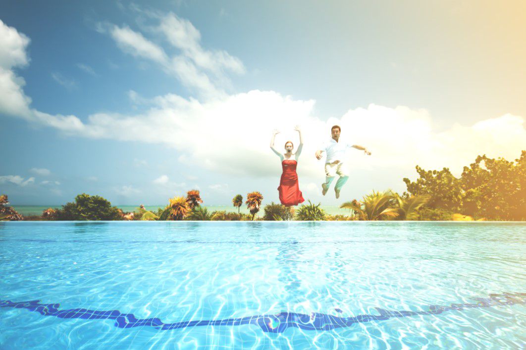 Man Woman Jumping Pool
