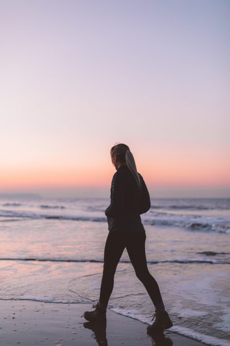 Woman Walking on Beach