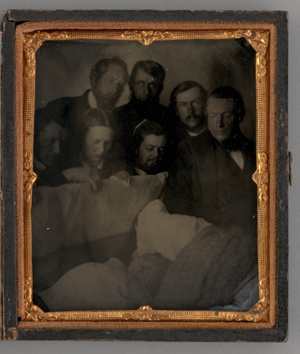 Untitled (People Standing Around a Open Casket)